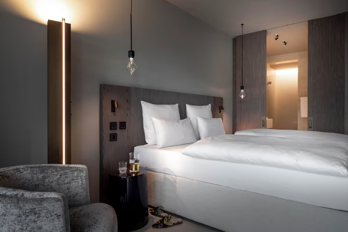 Modern hotel room with king bed and ambient lighting