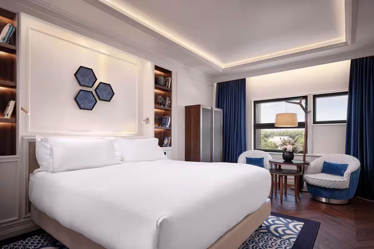 Elegant hotel room with large window and modern decor